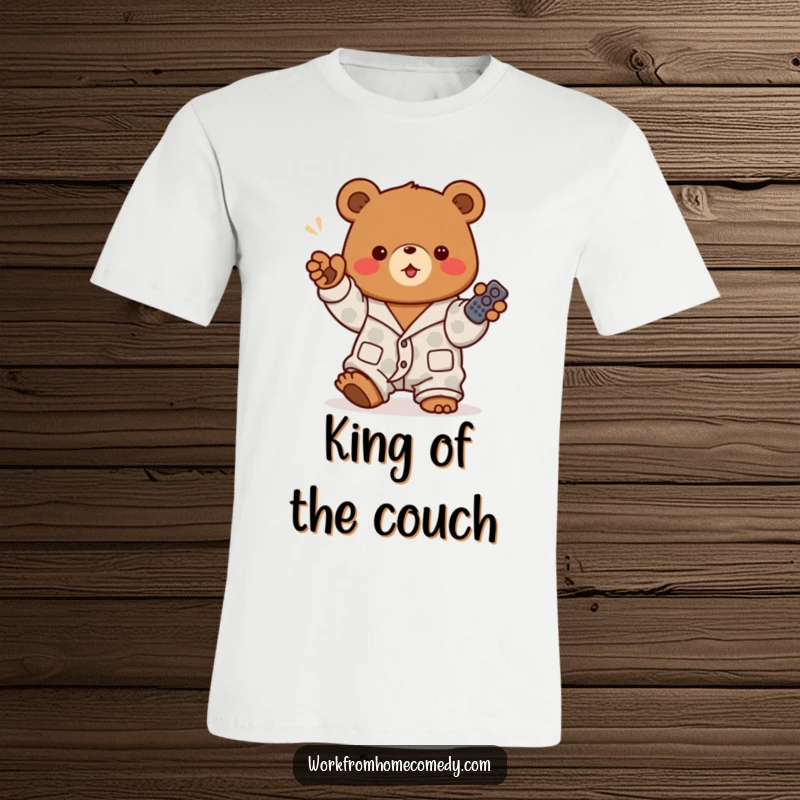 Funny brown bear in pajamas excitedly gesturing with a TV remote on a t-shirt, representing cozy entertainment and channel surfing.